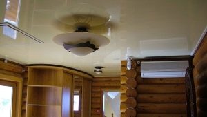 Stretch ceiling in a wooden house: pros and cons