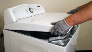 How are top-loading washing machines repaired?