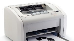 How do I insert paper into the printer?