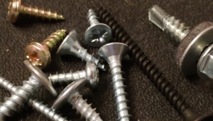 What is the difference between a screw and a self-tapping screw?