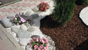 We decorate flower beds with marble chips