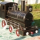 Kohlenbecken in Form einer Dampflokomotive: ein originelles Design auf Ihrer Website