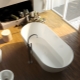Vasche da bagno in pietra artificiale: caratteristiche tecniche e caratteristiche di selezione