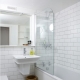 White bathroom tiles: material features and finishes