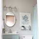 At what height should the mirror be hung over the sink in the bathroom?