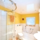 Stretch ceiling in the bathroom: pros and cons