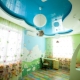 Two-level stretch ceiling in the interior of a children's room