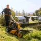 Petrol lawn mowers for uneven terrain: features and range