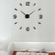 Large self-adhesive clock on the wall: how to choose and mount?