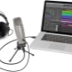 How do I connect a microphone to my laptop and set it up?