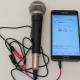 How do I connect a microphone to my phone?