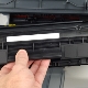 De cartridge in de printer vervangen
